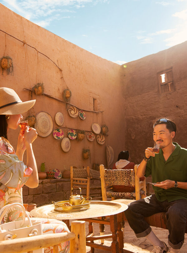 A man and woman drinking tea in Al-Ula Old Town